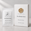 The Bridal Glow white box with gold wax seal and matching hydrogel eye-patch sachet — packaging design preview